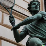 DALL·E 2022-10-01 10.40.19 - a photo of the sculpture of michelangelo playing tennis in italy.webp